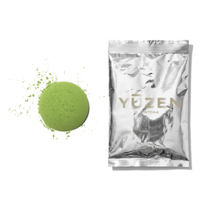 Atsumi culinary matcha sample in a silver foil sachet beside a disc of pale green powder