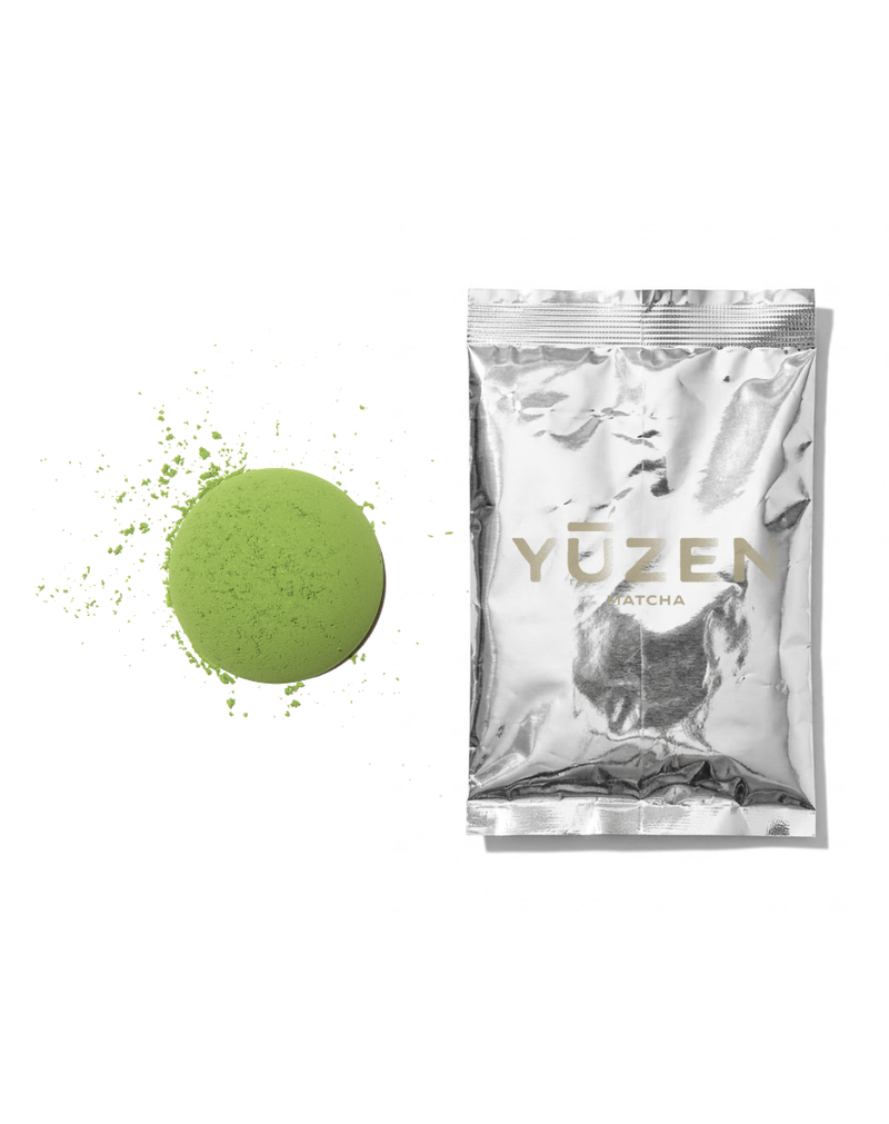 Atsumi culinary matcha sample in a silver foil sachet beside a disc of pale green powder