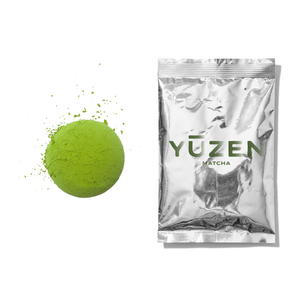Tsubasa café-grade matcha sample in a silver foil sachet beside a disc of green powder